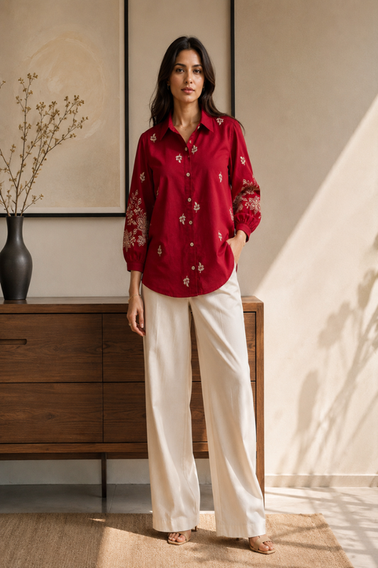 A woman wearing a embroidered shirt. Women's shirt. Embroidered Shirt. Ladies Shirt